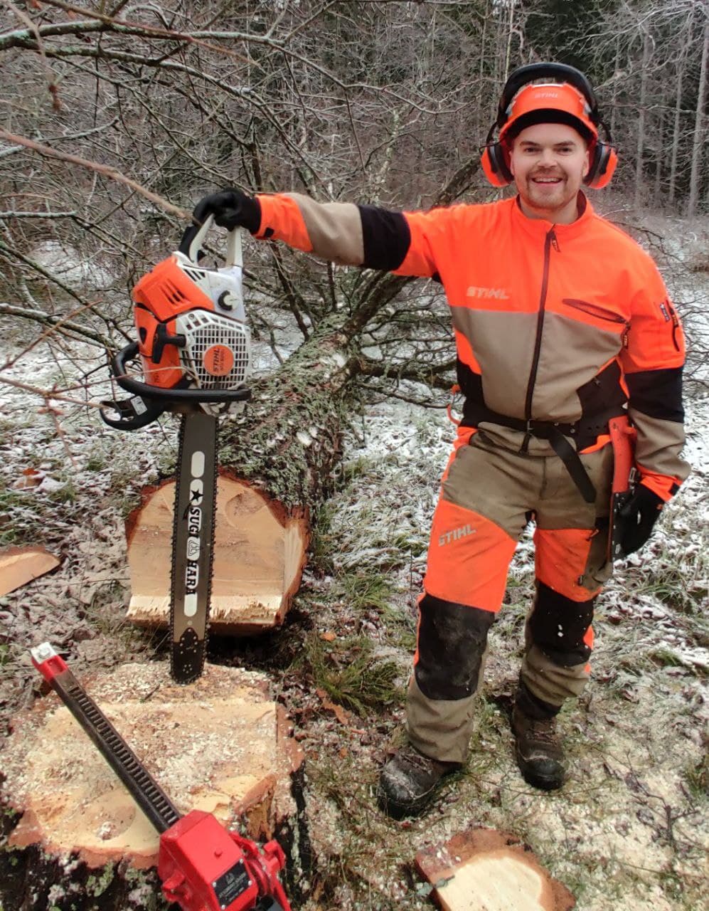 Me posing and leaning to my chainsaw after felling a large tree